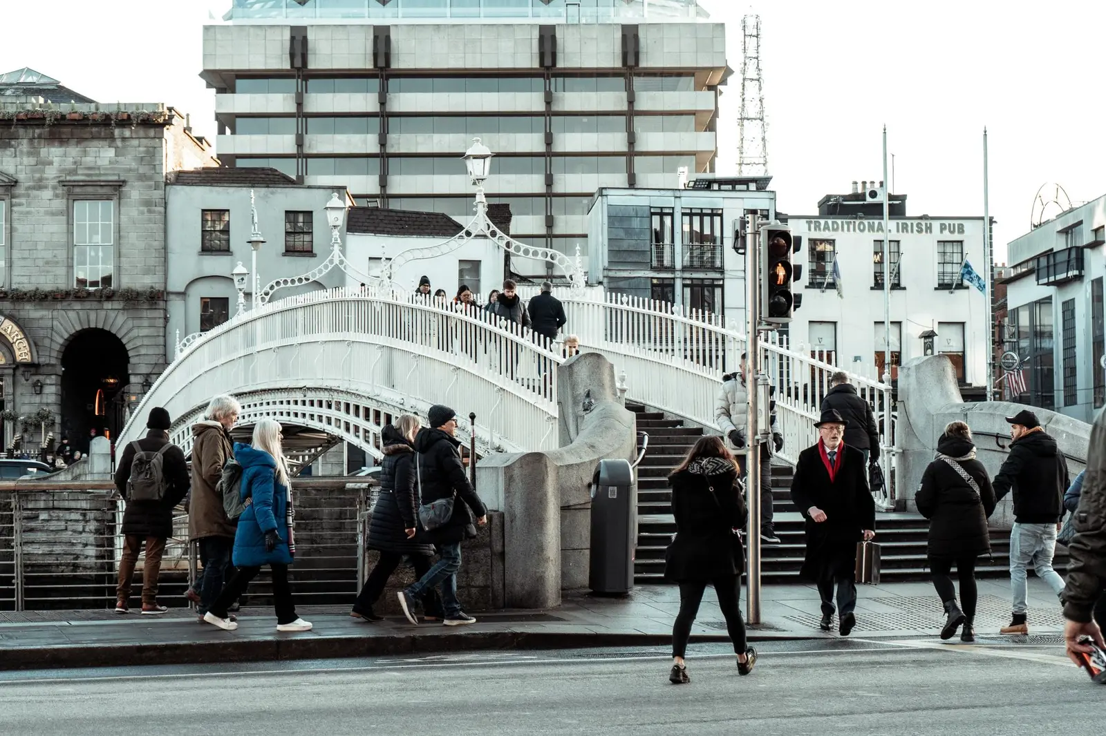 People crossing a street near the Ha'penny Bridge in Dublin