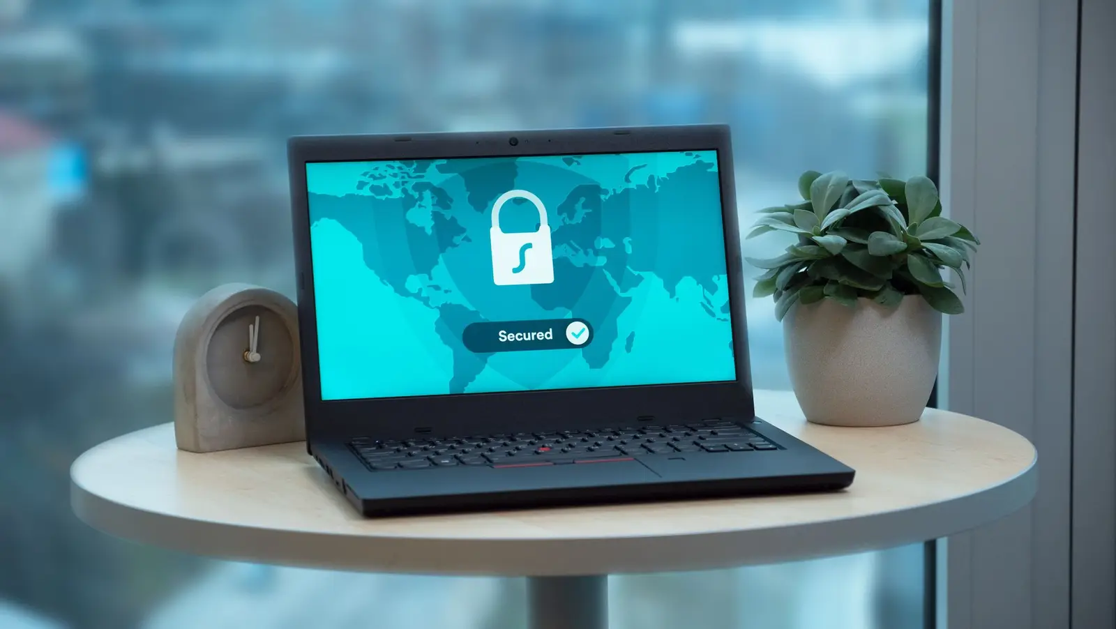 A laptop on a table showing a security lock icon