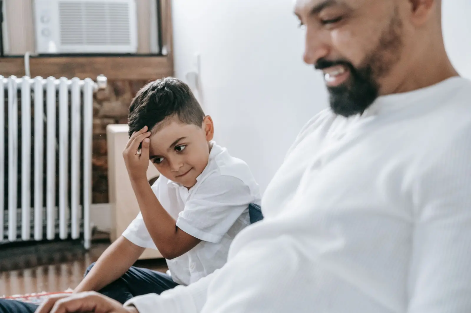 A father and son sharing a relaxed moment at home
